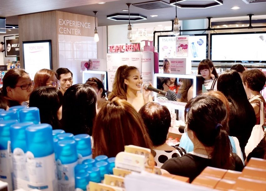 Shoppers at a Uriage counter during a Betime launch event