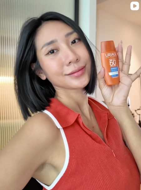 Creator holding product
